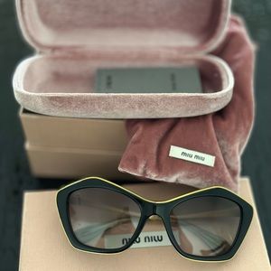 - MIU MIU sunglasses new black and gold new with  box